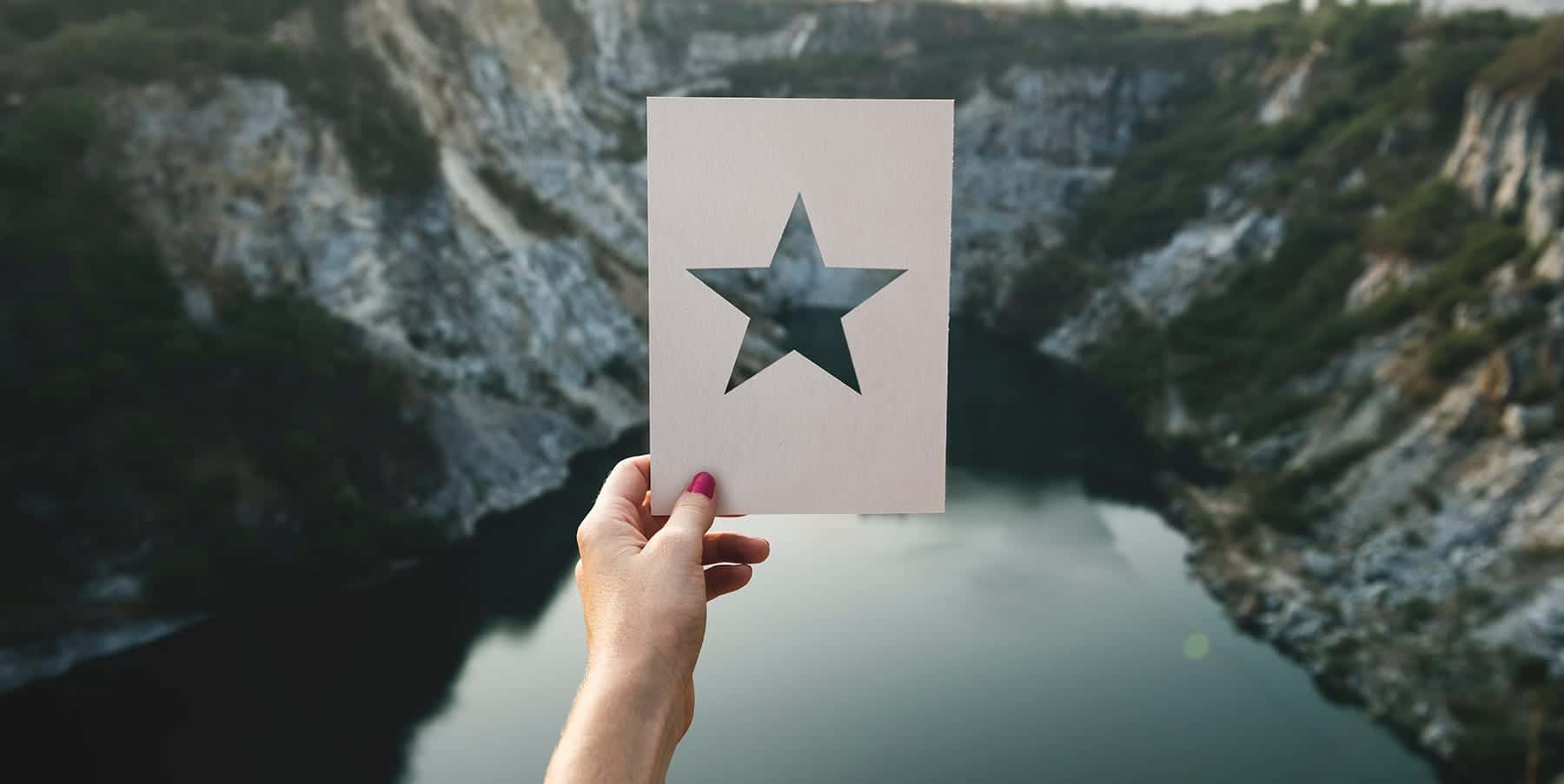 Person holding a card with star